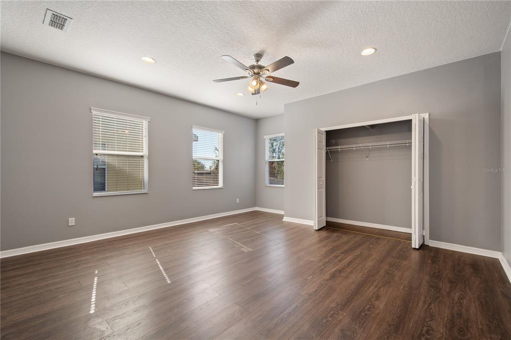 13118 Sunkiss Loop Windermere, FL 34786 - Photo 27 of 52 a view of an empty room with window and wooden floor