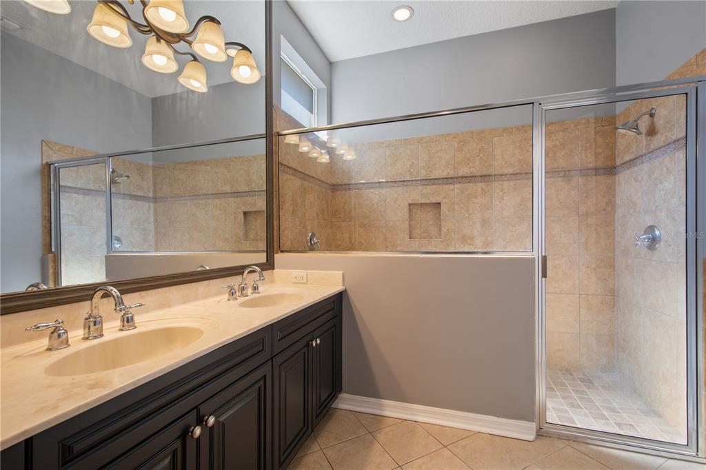 13118 Sunkiss Loop Windermere, FL 34786 - Photo 29 of 52 a bathroom with a sink and a mirror