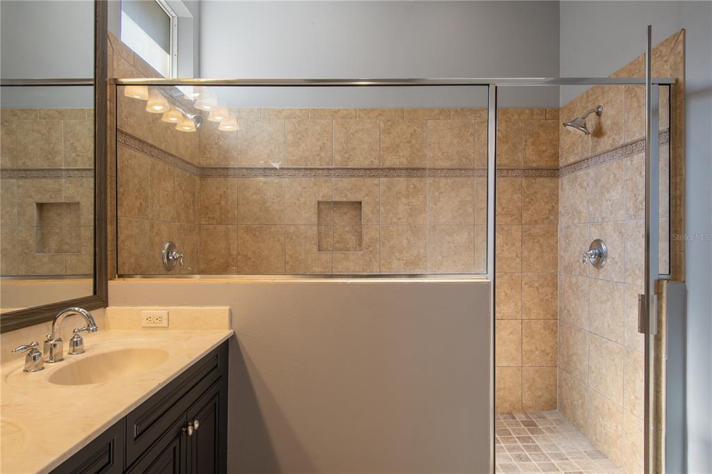 13118 Sunkiss Loop Windermere, FL 34786 - Photo 30 of 52 a bathroom with a shower and a sink