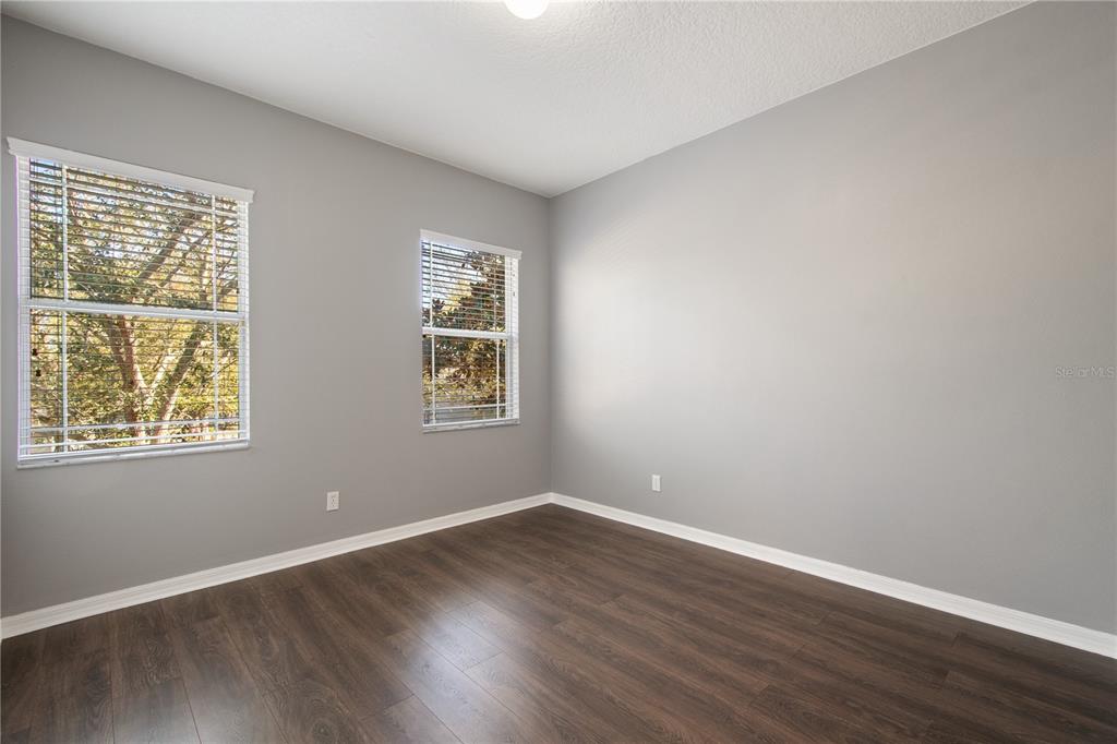 13118 Sunkiss Loop Windermere, FL 34786 - Photo 33 of 52 a view of an empty room with wooden floor and a window