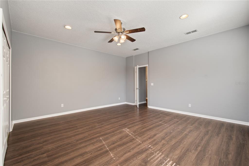 13118 Sunkiss Loop Windermere, FL 34786 - Photo 34 of 52 wooden floor in an empty room with a window