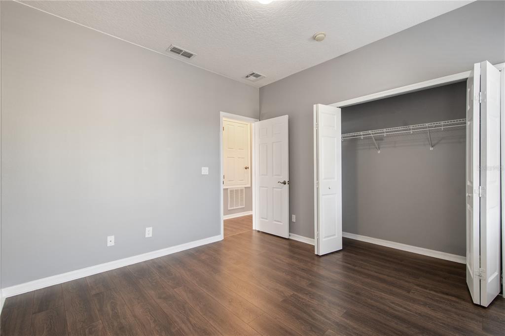 13118 Sunkiss Loop Windermere, FL 34786 - Photo 37 of 52 a view of an empty room with wooden floor