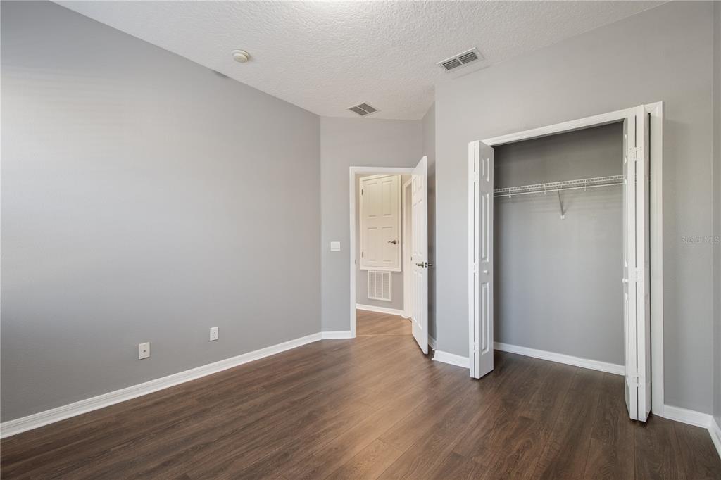 13118 Sunkiss Loop Windermere, FL 34786 - Photo 39 of 52 a view of an empty room with wooden floor and closet