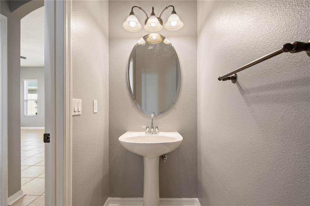 13118 Sunkiss Loop Windermere, FL 34786 - Photo 40 of 52 a bathroom with a sink and a mirror