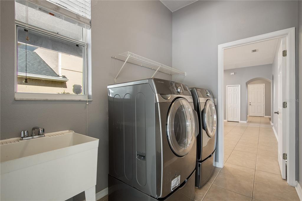 13118 Sunkiss Loop Windermere, FL 34786 - Photo 41 of 52 a utility room with dryer and washer