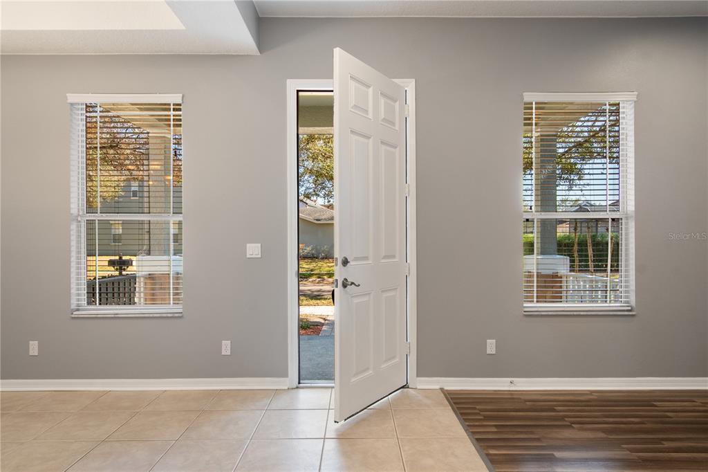 13118 Sunkiss Loop Windermere, FL 34786 - Photo 5 of 52 a view of an empty room with windows