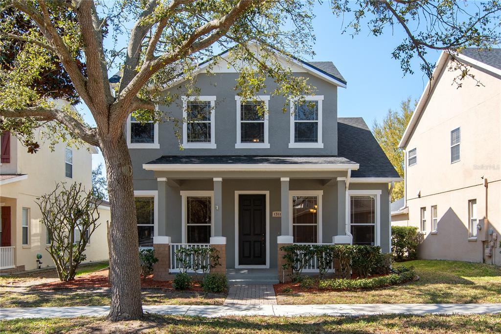 13118 Sunkiss Loop Windermere, FL 34786 - Photo 52 of 52 a front view of a house with garden