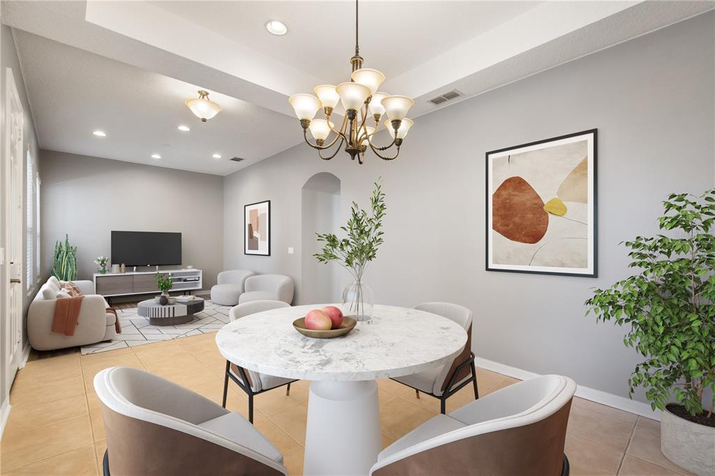 13118 Sunkiss Loop Windermere, FL 34786 - Photo 7 of 52 a dining room with furniture and chandelier