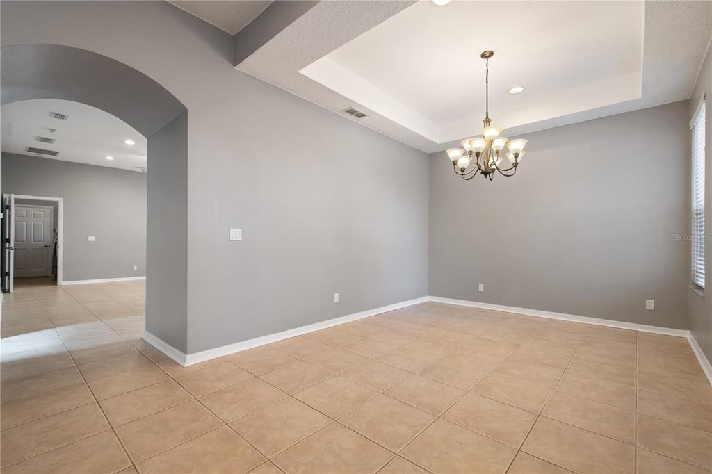 13118 Sunkiss Loop Windermere, FL 34786 - Photo 10 of 52 a view of an empty room with a mirror