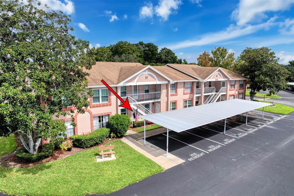 6433 Tina Drive, Unit 12 New Port Richey, FL 34653 - Photo 2 of 24 a house with swimming pool in front of it