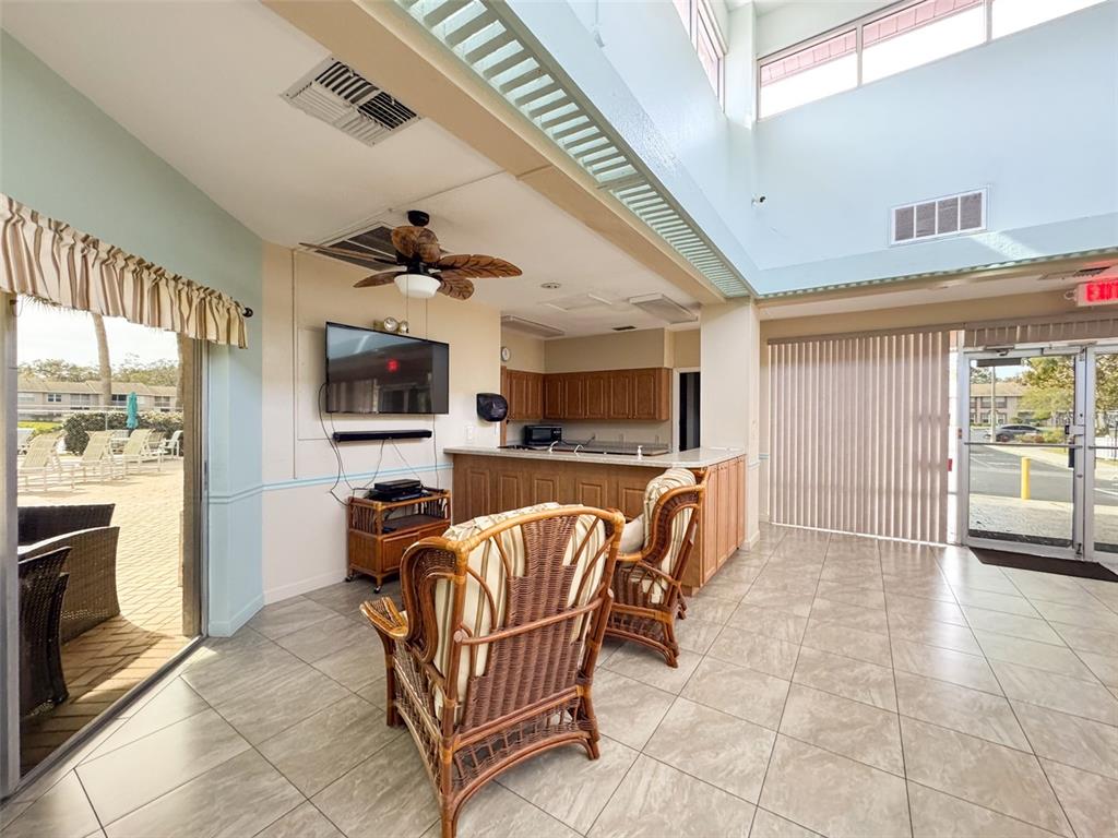 6433 Tina Drive, Unit 12 New Port Richey, FL 34653 - Photo 23 of 24 a view of a livingroom with kitchen and furniture