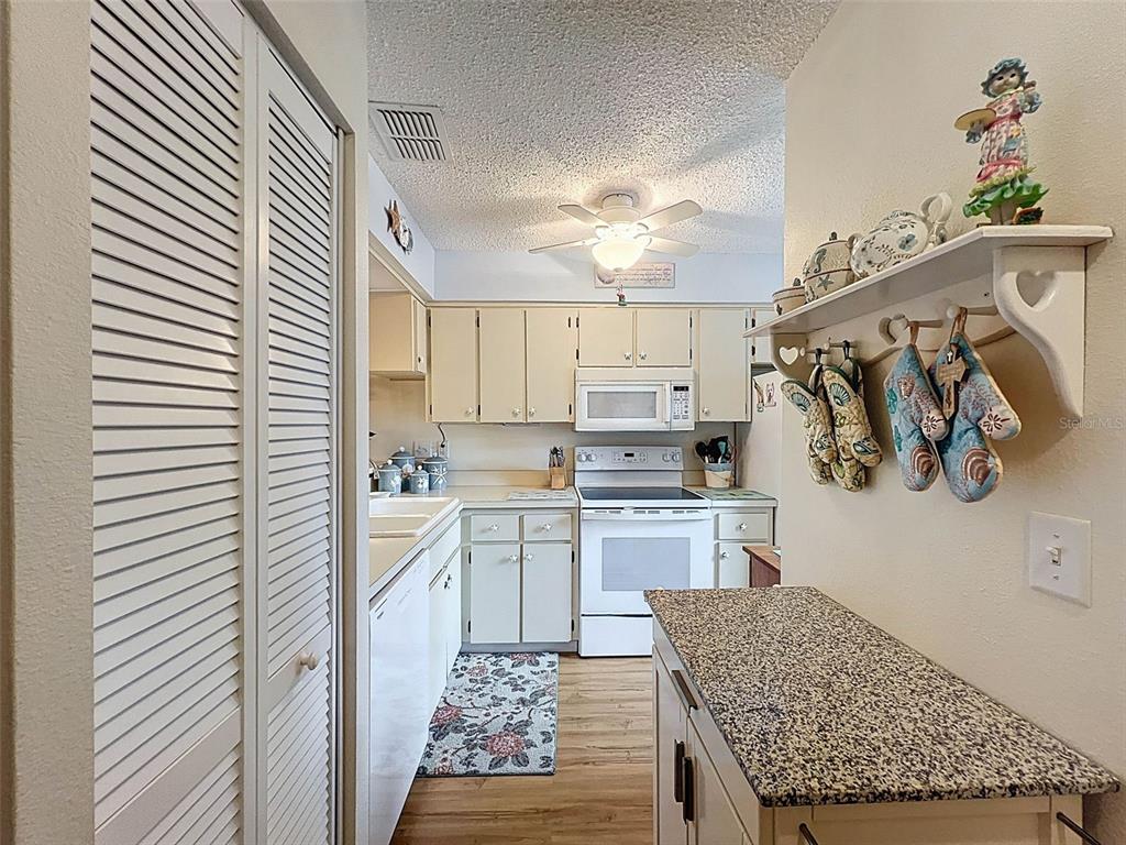 6433 Tina Drive, Unit 12 New Port Richey, FL 34653 - Photo 7 of 24 a kitchen with a sink and cabinets