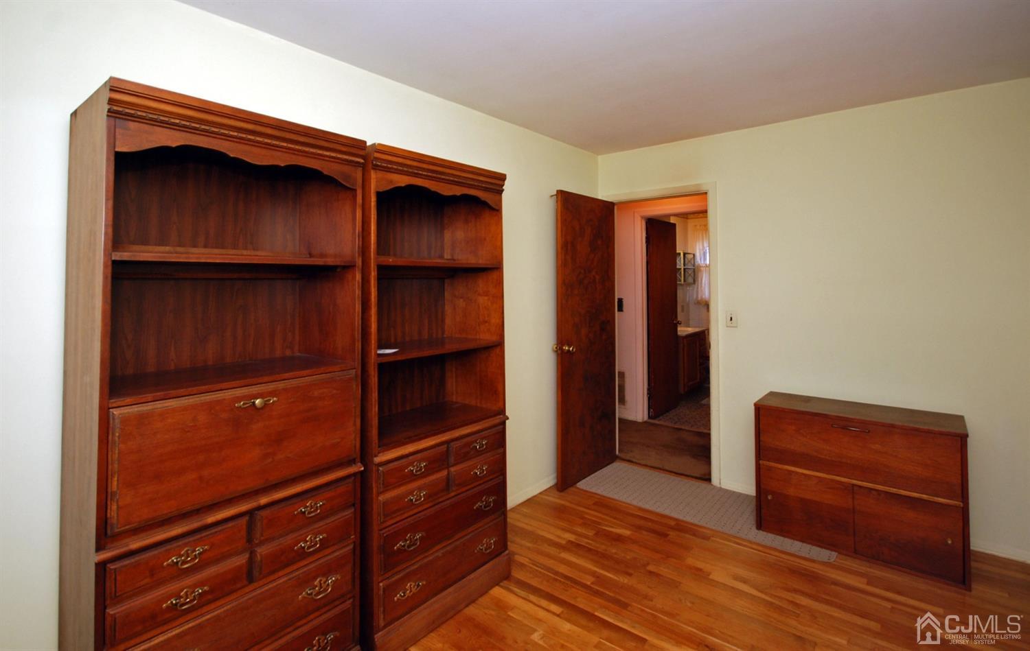 48 Delaware Avenue Middlesex, NJ 08846 - Photo 11 of 15 a view of walk in closet with clothes and shoes