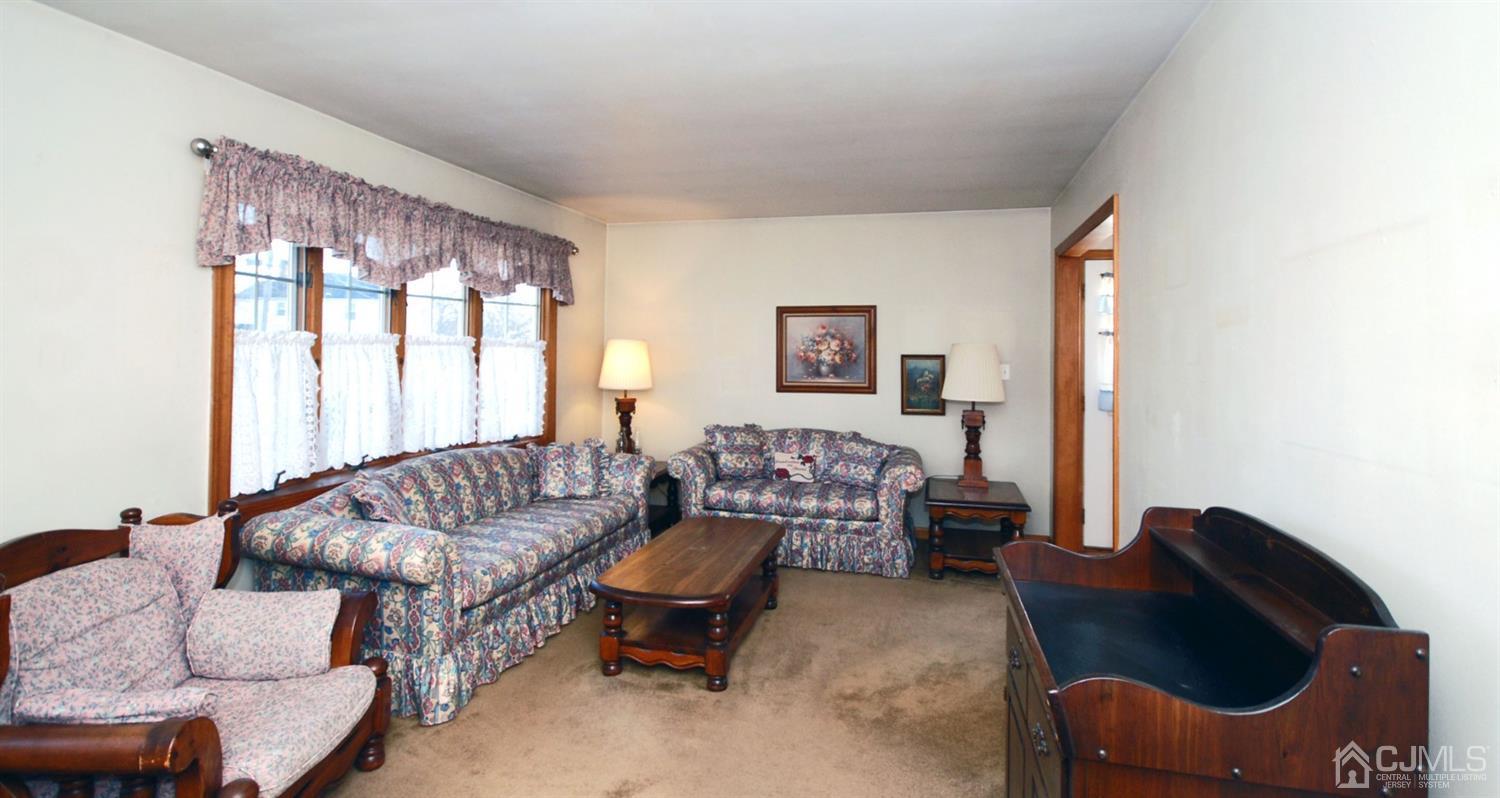 48 Delaware Avenue Middlesex, NJ 08846 - Photo 3 of 15 a living room with furniture and a large window