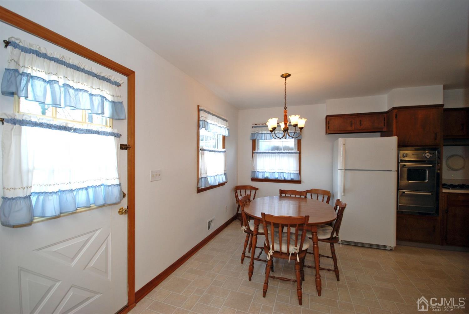 48 Delaware Avenue Middlesex, NJ 08846 - Photo 5 of 15 a dining room with furniture and window