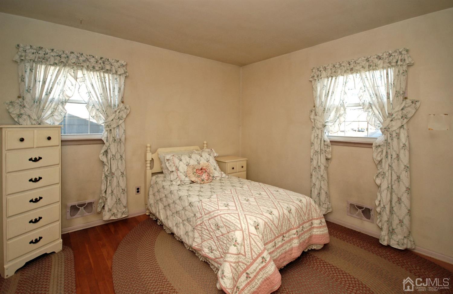 48 Delaware Avenue Middlesex, NJ 08846 - Photo 10 of 15 a bedroom with a bed and a dresser