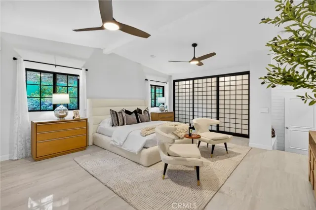 a bathroom with a sink mirror and toilet