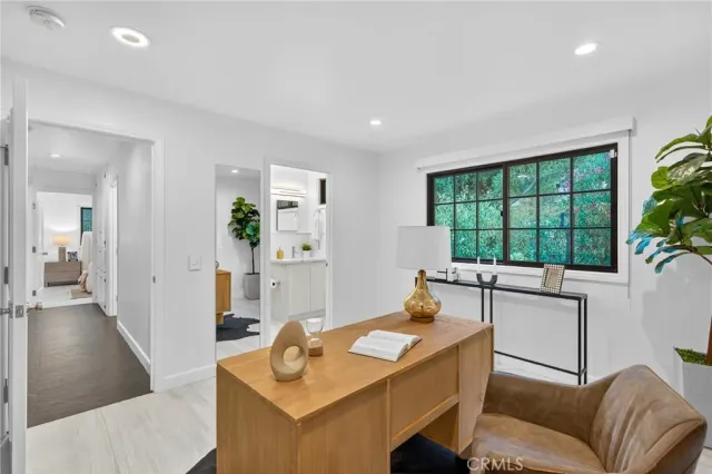 a bathroom with a granite countertop sink a toilet and shower