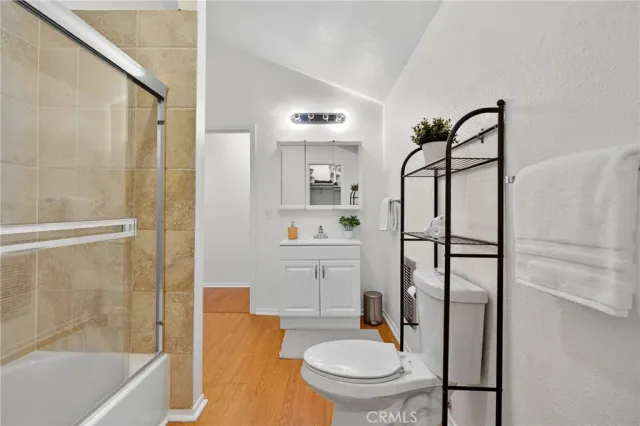 a living room with lots of furniture and kitchen view