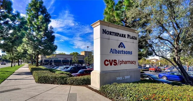a view of a park with large trees