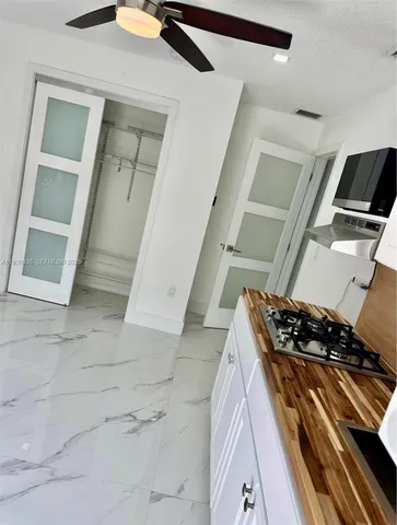 a view of a backyard with sitting area