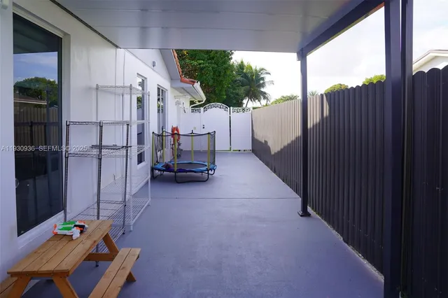 a living room with furniture and a garden
