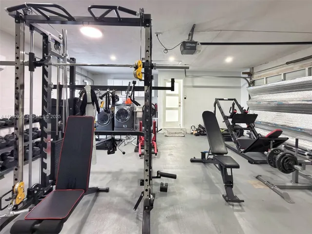 a utility room with sink dryer and washer