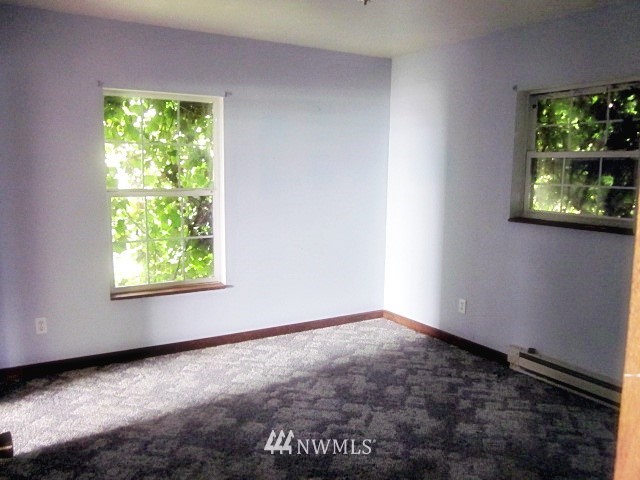 266 Stringtown Road Ilwaco, WA 98624 - Photo 11 of 13 a view of an empty room with a window