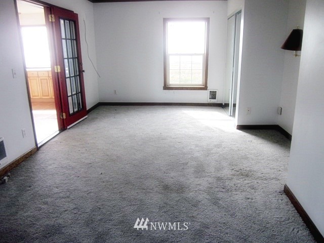 266 Stringtown Road Ilwaco, WA 98624 - Photo 12 of 13 an empty room with windows