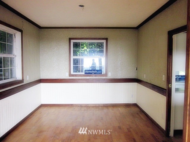 266 Stringtown Road Ilwaco, WA 98624 - Photo 3 of 13 a view of an empty room with a window