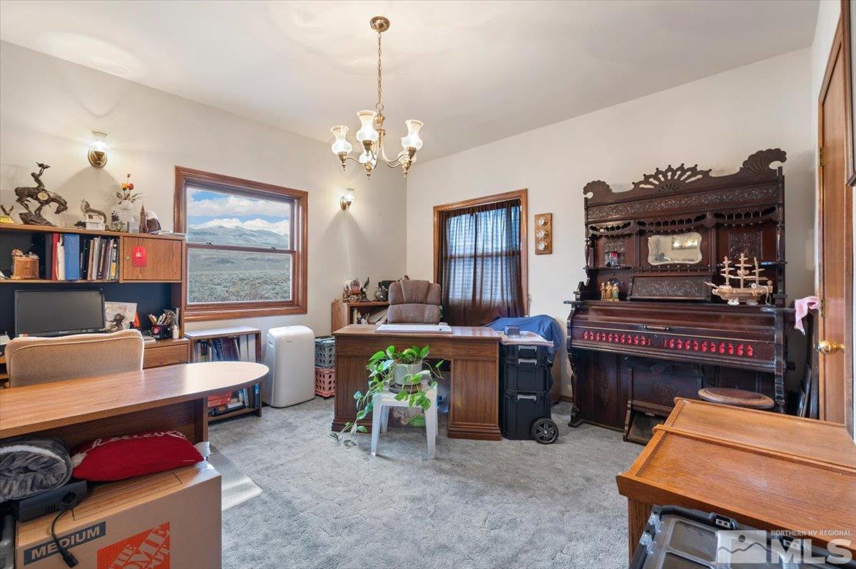 5790 Whiskey Springs Road Reno, NV 89510 - Photo 31 of 40 a living room with furniture a fireplace and a window