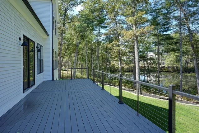 a view of a balcony with wooden floor