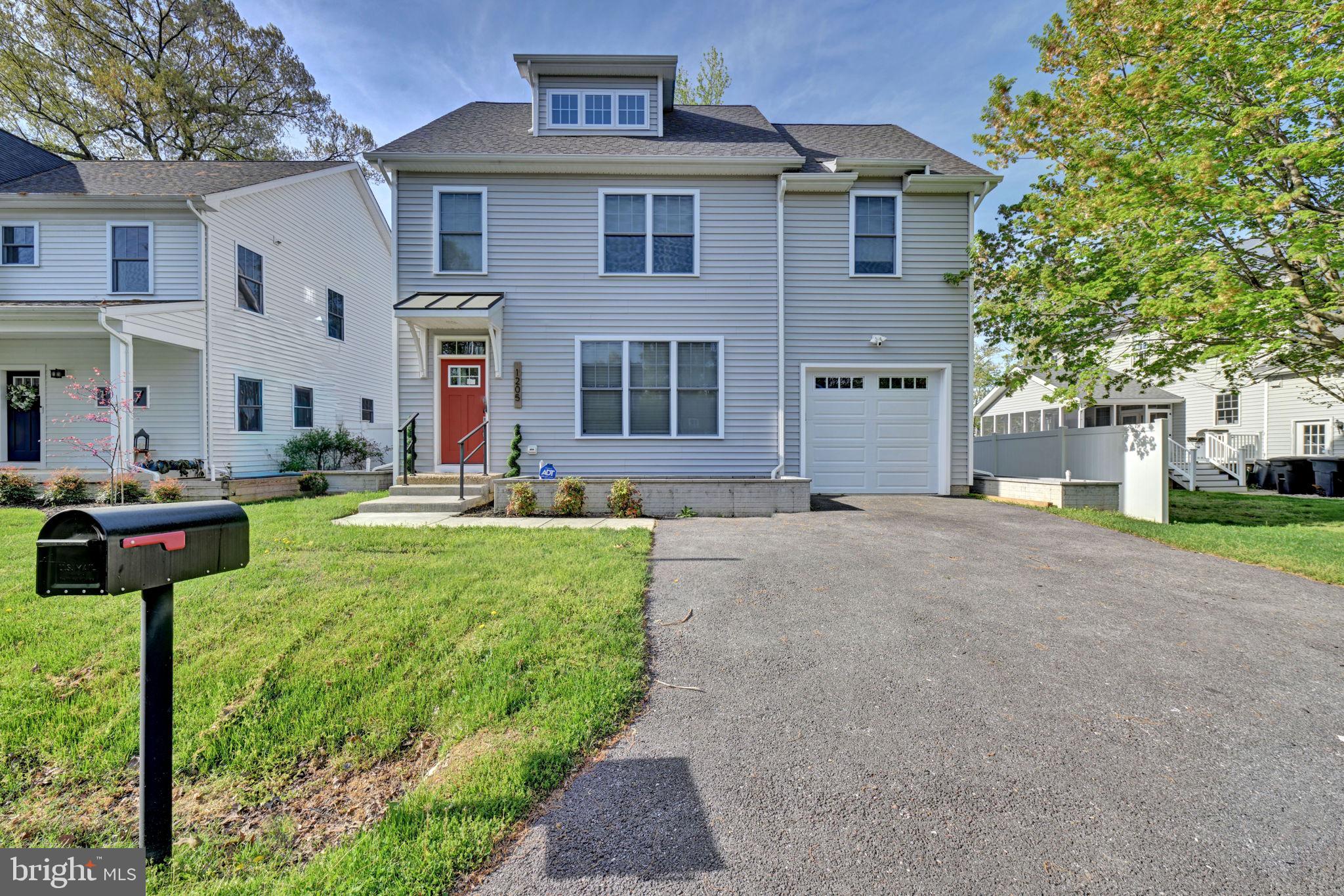 1205 Hawthorne Street Shady Side, MD 20764 - Photo 1 of 35 a front view of a house with garden