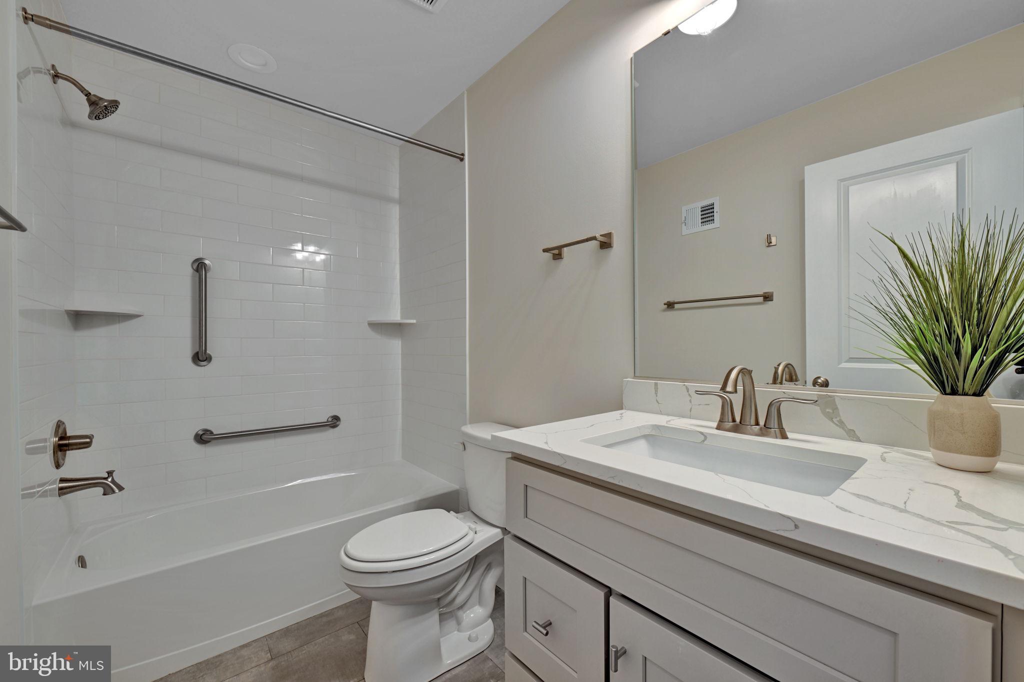 1205 Hawthorne Street Shady Side, MD 20764 - Photo 20 of 35 a bathroom with a sink a toilet and shower