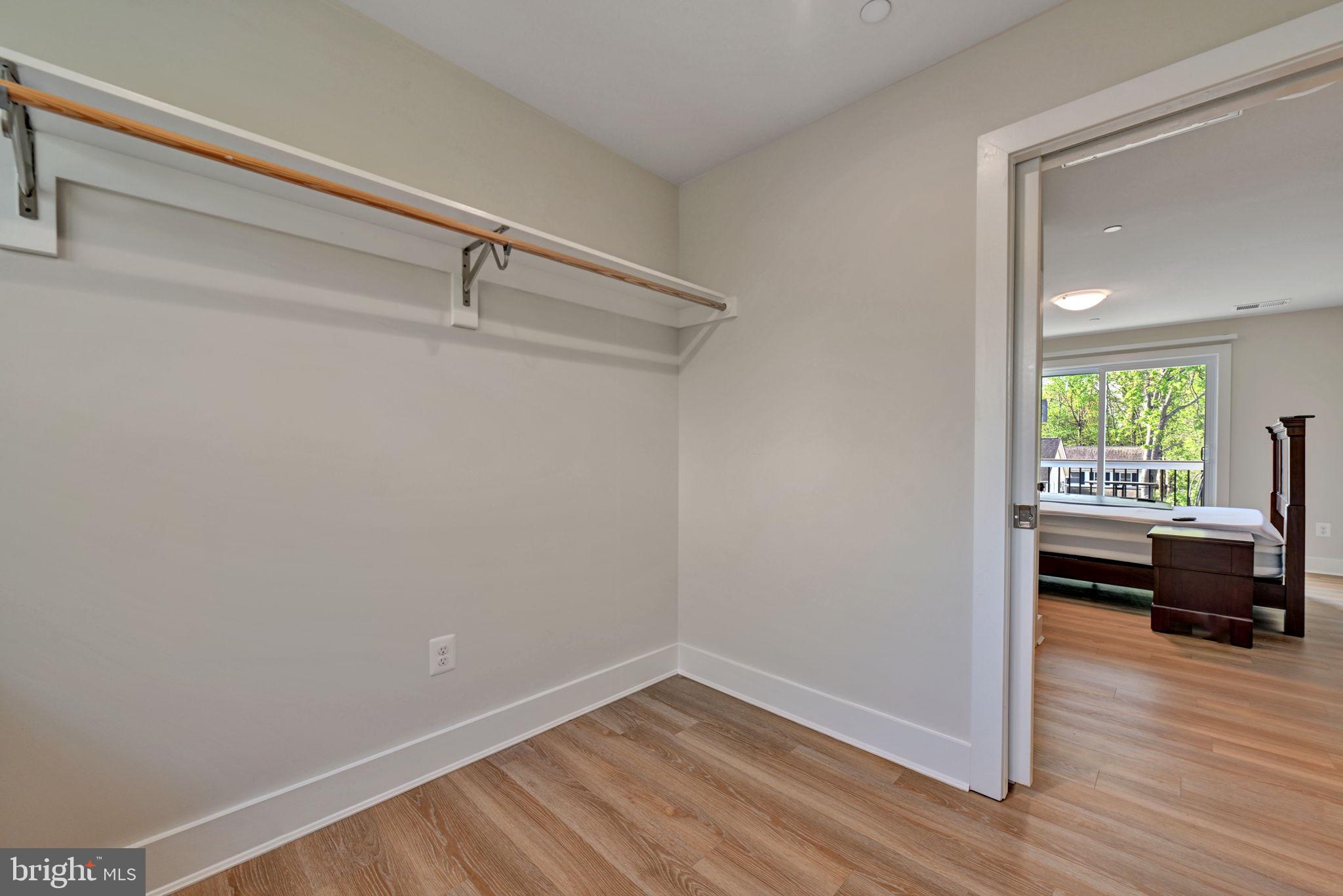 1205 Hawthorne Street Shady Side, MD 20764 - Photo 23 of 35 a view of empty room with wooden floor and fan