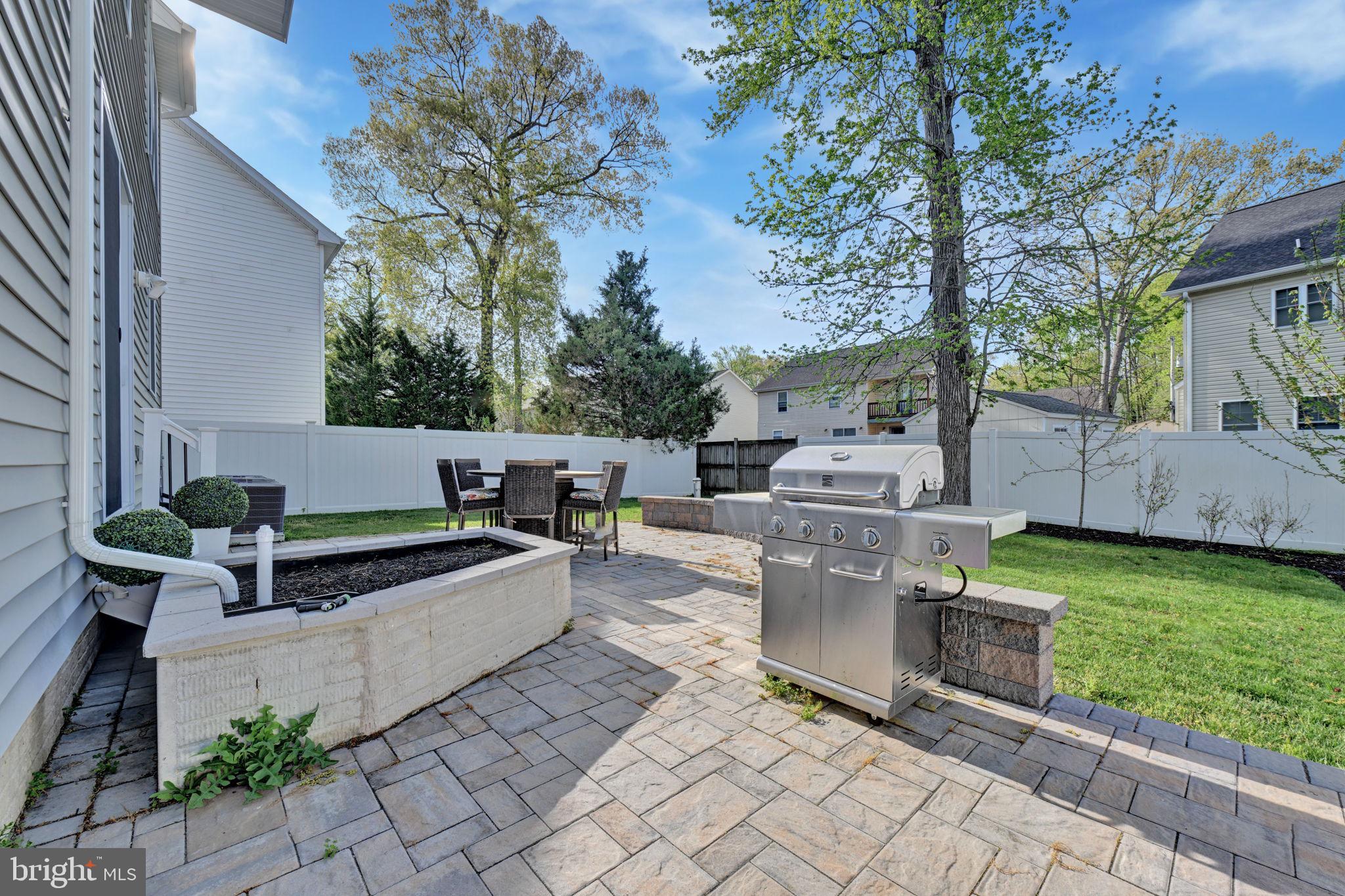 1205 Hawthorne Street Shady Side, MD 20764 - Photo 30 of 35 a front view of a house with garden and sitting area