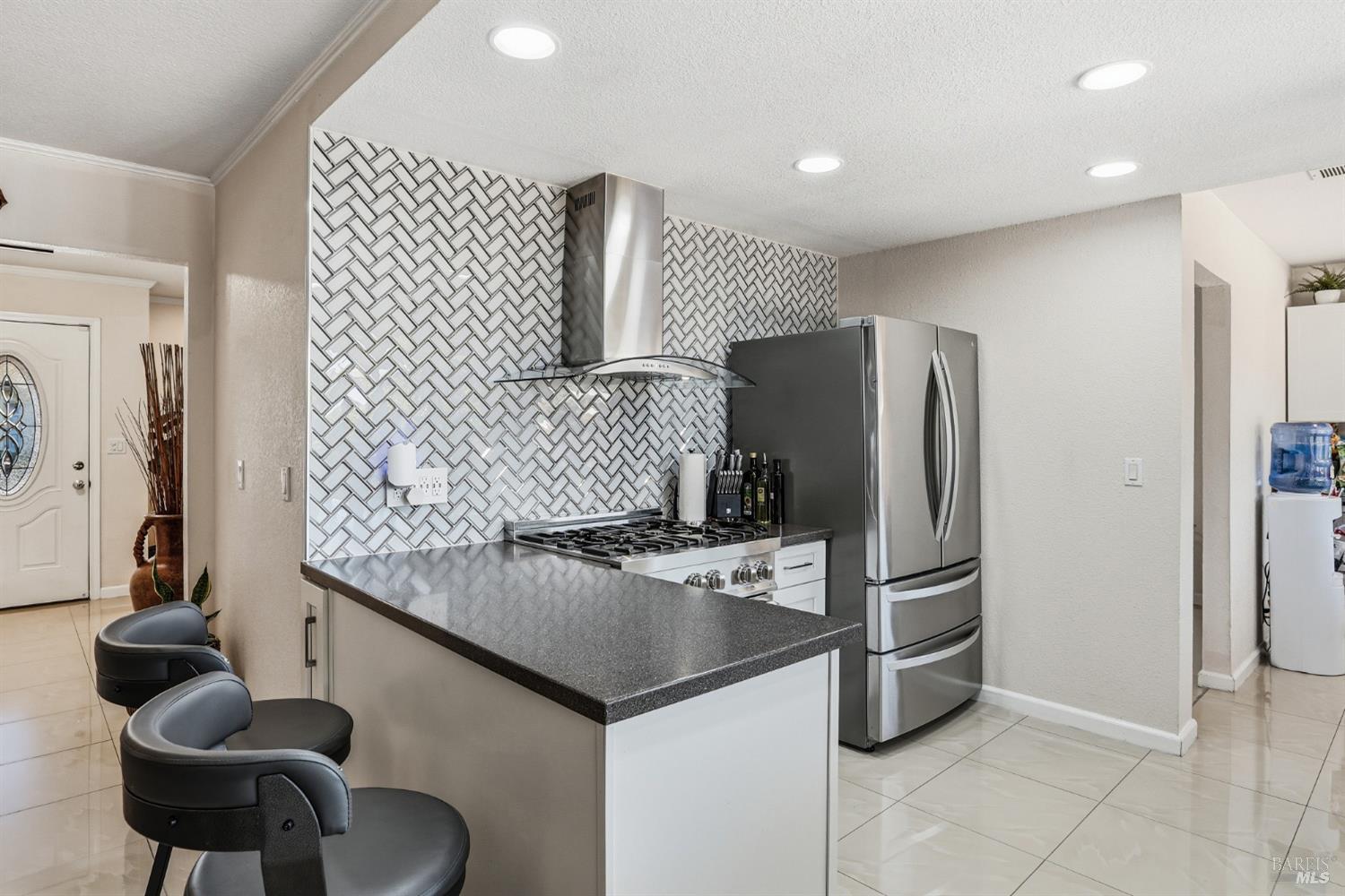 773 Blue Ridge Lane Vacaville, CA 95688 - Photo 19 of 44 a kitchen with kitchen island stainless steel appliances a sink and a refrigerator