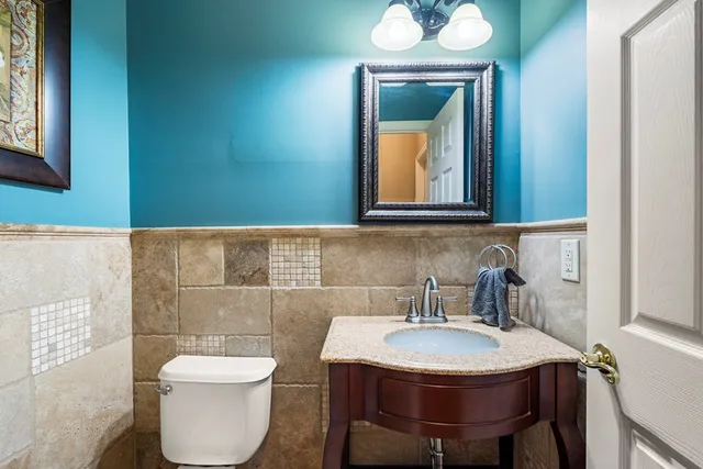 a bath tub sitting in a bathroom next to a window