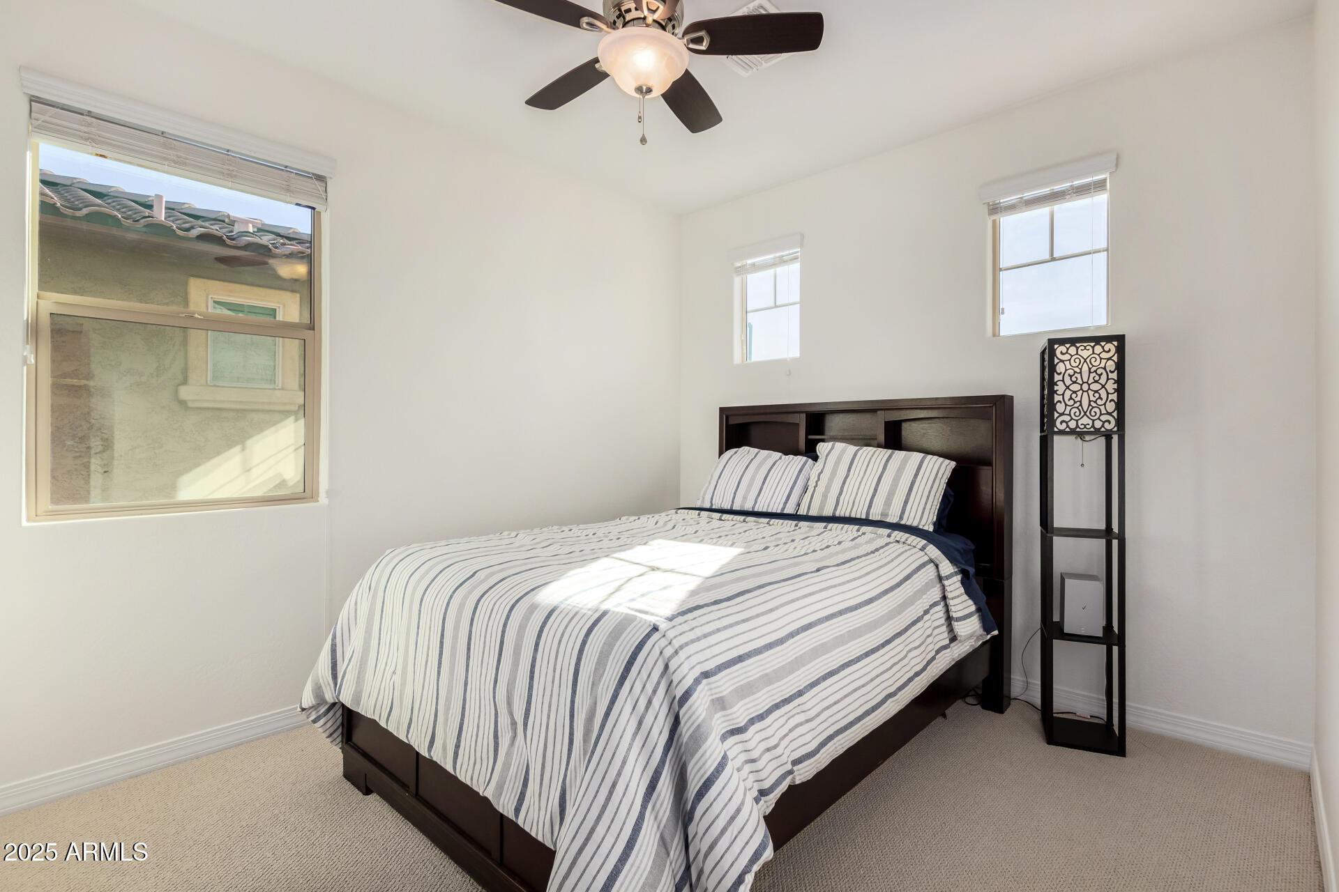 3420 East Indigo Street Gilbert, AZ 85298 - Photo 16 of 27 a bedroom with a bed and window