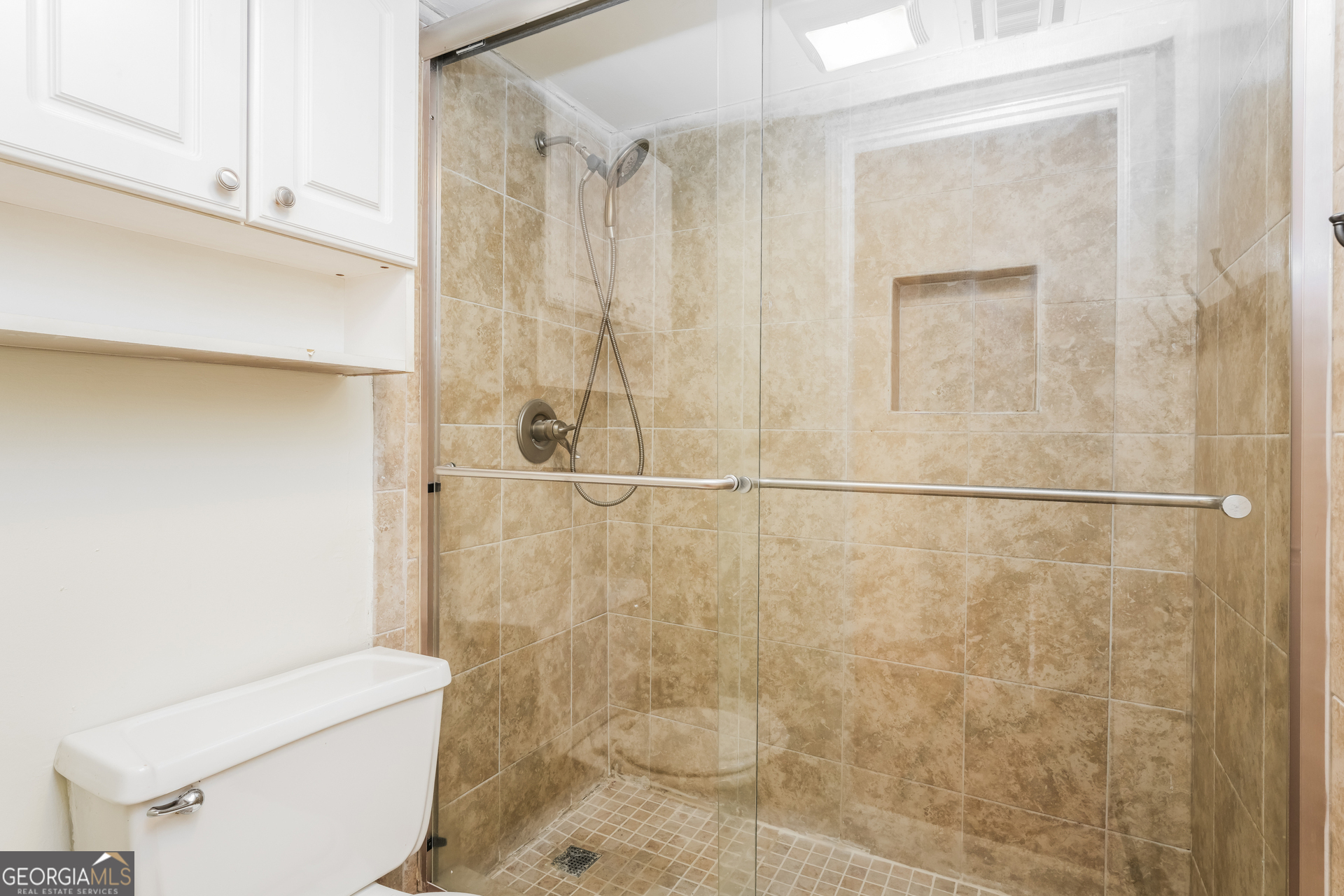 35 La Rue Place Northwest Atlanta, GA 30327 - Photo 12 of 20 a bathroom with a shower and a toilet