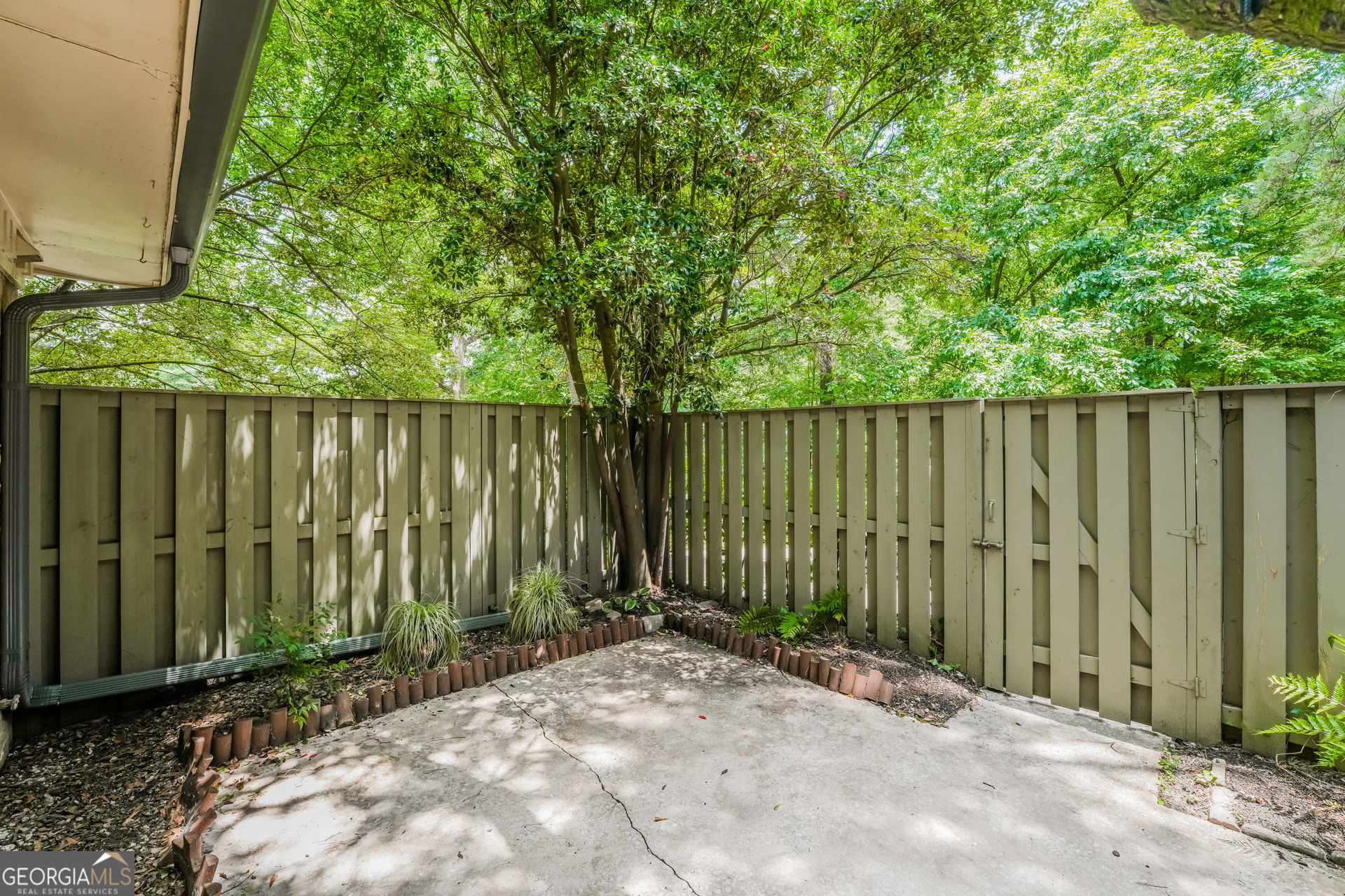 35 La Rue Place Northwest Atlanta, GA 30327 - Photo 19 of 20 a view of a backyard with green space