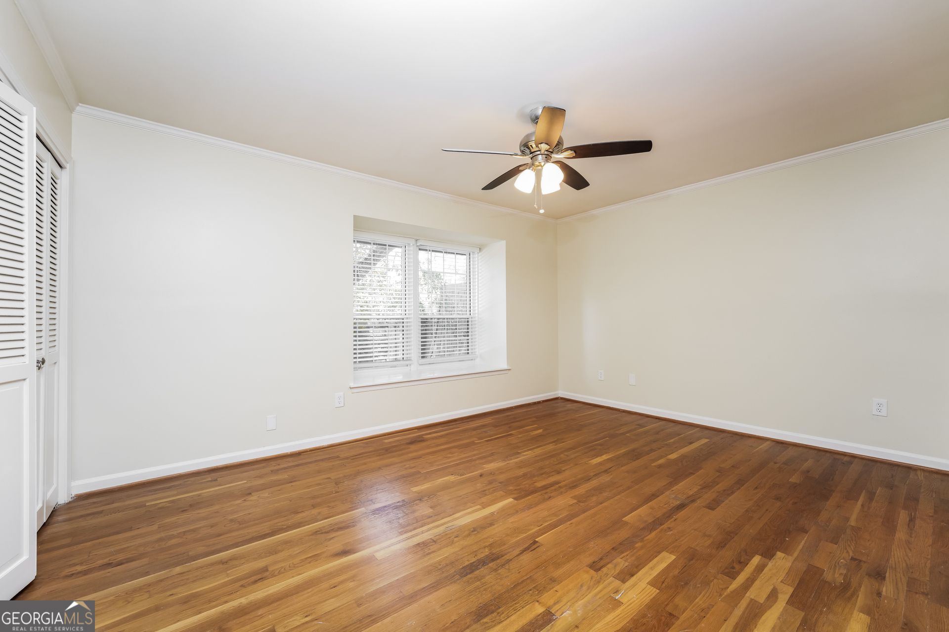 35 La Rue Place Northwest Atlanta, GA 30327 - Photo 9 of 20 a view of empty room with wooden floor and fan
