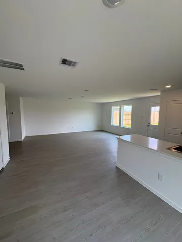 a view of livingroom and hardwood floor