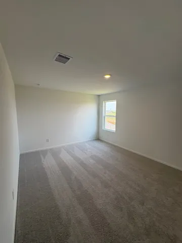 a view of empty room with windows