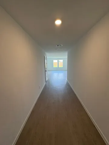 a view of empty room with windows