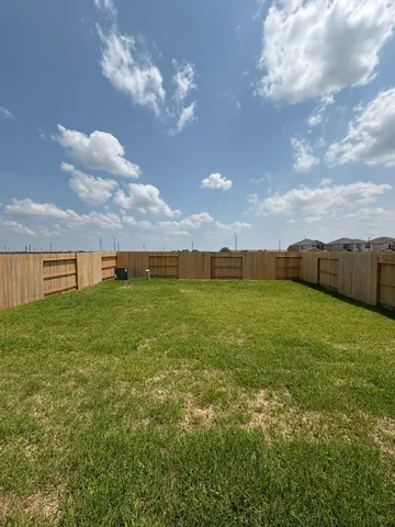 a view of a big yard with an outdoor space