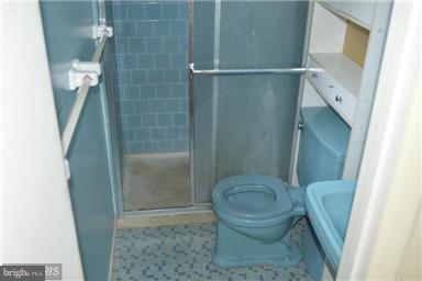 406 Irwin Street Silver Spring, MD 20901 - Photo 14 of 30 a bathroom with a toilet and a shower