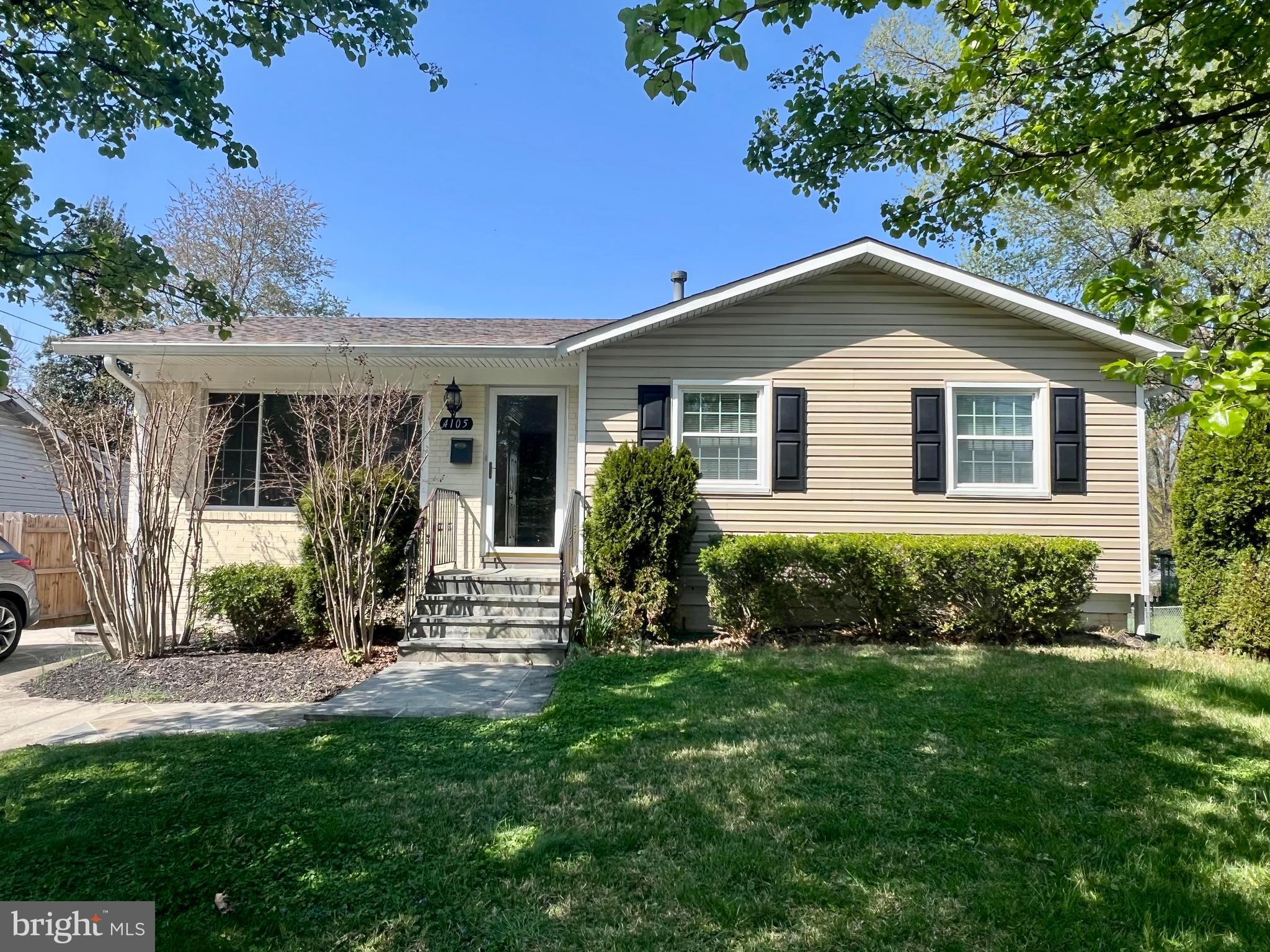 4105 Isbell Street Silver Spring, MD 20906 - Photo 1 of 19 a view of a house with yard and a garden