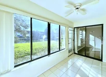 a view of an entryway with a floor to ceiling window