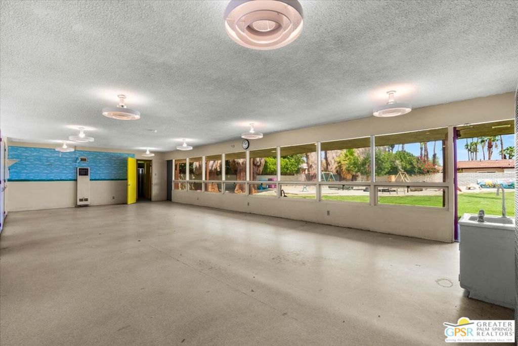 490 South Compdre Road Palm Springs, CA 92262 - Photo 12 of 15 a view of an empty room with a floor to ceiling window and a room